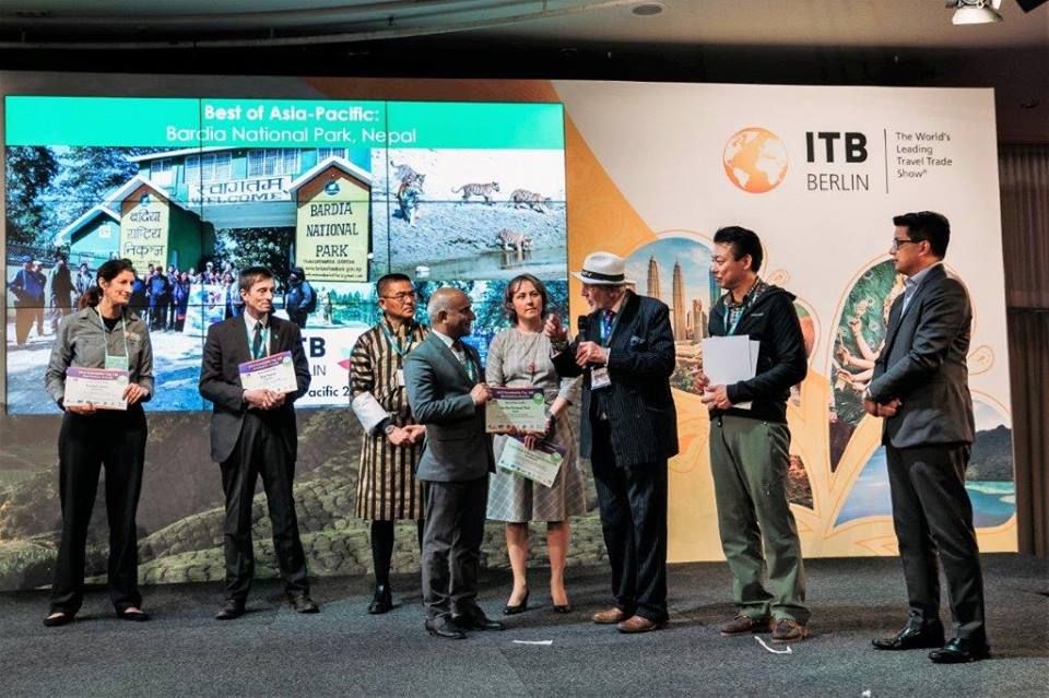 The CEO of Nepal Tourism Board, Mr. Deepak Raj Joshi receiving the award